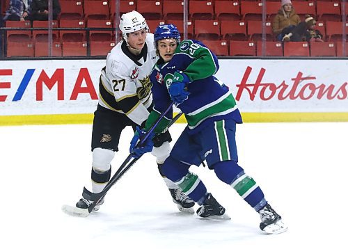 Swift Current Broncos forward Braeden Lewis (20) of Virden jockeys for position against Brandon Wheat Kings defenceman Luke Shipley (27) during their Western Hockey League game at Westoba Place last Tuesday. (Perry Bergson/The Brandon Sun)