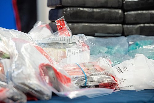 Mike Sudoma/Winnipeg Free Press
Large bundles of cash amounting to approximately five hundred thousand dollars sit amongst large quantities of cocaine and methamphetamine during a press conference Friday afternoon
February 16, 2023 