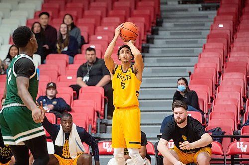 Mike Sudoma/Winnipeg Free Press
Bobcats Guard Christian Konu lands a successful three point throw as they take on the Cascades at the University of Winnipeg&#x2019;s Duckworth Centre Friday afternoon
February 17, 2023 