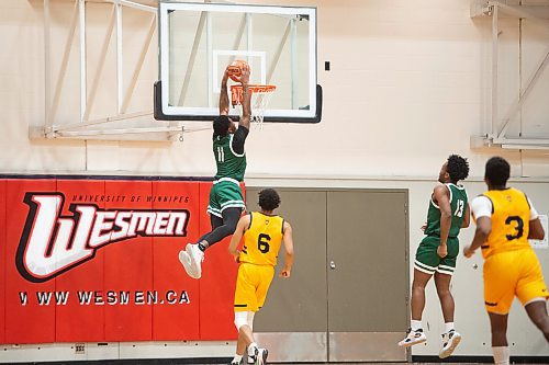 Mike Sudoma/Winnipeg Free Press
Cascades Guard, Chris Jackson ends a break away with a slam dunk against the Brandon University Bobcats at the University of Winnipeg&#x2019;s Duckworth Centre Friday afternoon
February 17, 2023 