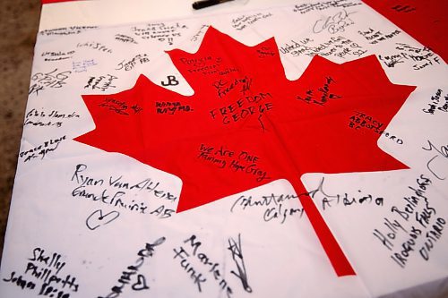 Mike Sudoma/Winnipeg Free Press
A Canadian flag signed by World Unity Convoy supporters Saturday
February 17, 2023 