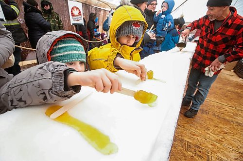 JOHN WOODS / WINNIPEG FREE PRESS
A person rolls their maple taffy at the Festival du Voyageur in Winnipeg, Sunday, February 19, 2023. 

Re: pindera