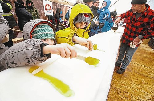 JOHN WOODS / WINNIPEG FREE PRESS
A person rolls their maple taffy at the Festival du Voyageur in Winnipeg, Sunday, February 19, 2023. 

Re: pindera