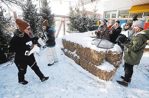 JOHN WOODS / WINNIPEG FREE PRESS
Members of team Big Cat Energy cheer on their athletes as they start the next leg of the skate relay race at the Beer Can Olympics outside the Gas Station Theatre in Osborne Village in Winnipeg, Sunday, February 19, 2023. 

Re: ?