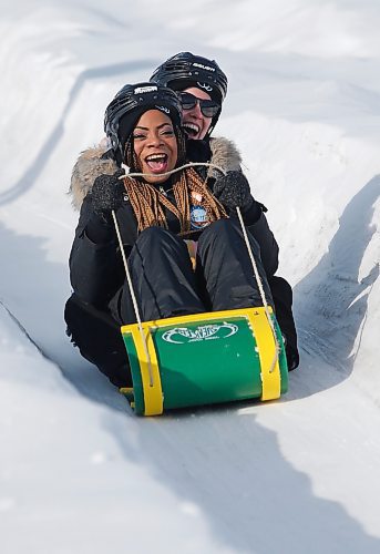 JOHN WOODS / WINNIPEG FREE PRESS
Rebecca Alao, left, and Diana Jensen, students from University of Regina who came to Winnipeg for the Festival du Voyageur, slide down a toboggan run at the festival, Sunday, February 19, 2023. 

Re: pindera