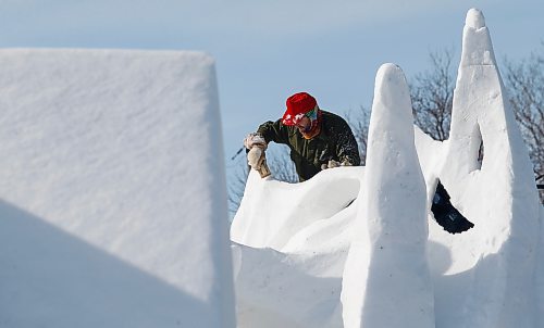 JOHN WOODS / WINNIPEG FREE PRESS
An snow sculptor works on his sculpture at the Festival du Voyageur in Winnipeg, Sunday, February 19, 2023. 

Re: pindera