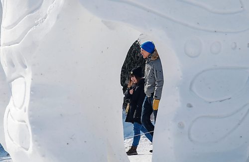 JOHN WOODS / WINNIPEG FREE PRESS
A couple is seen through a snow sculpture at the Festival du Voyageur in Winnipeg, Sunday, February 19, 2023. 

Re: pindera