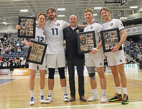 Coach Grant Wilsonm, centre, and the Brandon University Bobcats recognized men's volleyball seniors Rylan Metcalf, from left, Bryston Keck, Max Brook and Nigel Tolley at their final Canada West match of the regular season on Saturday. (Thomas Friesen/The Brandon Sun)