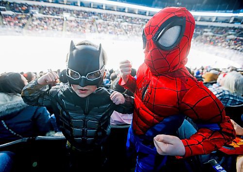 JOHN WOODS / WINNIPEG FREE PRESS
Batman, aka, Owen Gmiterek, left, and Spiderman, aka, Spencer Welch, were showing off their muscles during Super Hero Day at the Manitoba Moose versus Grand Rapids Griffins AHL game in Winnipeg on Monday, February 20, 2023.

Reporter: standup