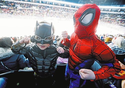 JOHN WOODS / WINNIPEG FREE PRESS
Batman, aka, Owen Gmiterek, left, and Spiderman, aka, Spencer Welch, were showing off their muscles during Super Hero Day at the Manitoba Moose versus Grand Rapids Griffins AHL game in Winnipeg on Monday, February 20, 2023.

Reporter: standup