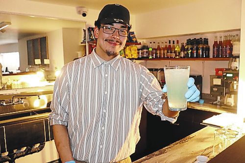 Brennan Myran whips up a virgin margarita at Club 1202, Brandon's first sober bar, this past Saturday night. This dry establishment has been operating since January and is being run by members of the Community Health and Housing Association and the Building Re-Fit Store. (Kyle Darbyson/The Brandon Sun)