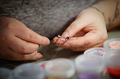 JOHN WOODS / WINNIPEG FREE PRESS
Samantha Silvester works on her beading project during the Louis Riel Day celebration at the Saint Boniface Museum in Winnipeg, Monday, February 20, 2023.

Reporter: Pindera