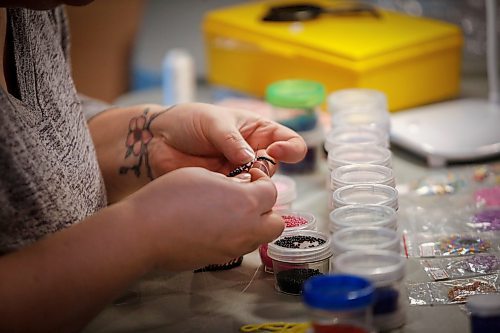 JOHN WOODS / WINNIPEG FREE PRESS
Samantha Silvester works on her beading project during the Louis Riel Day celebration at the Saint Boniface Museum in Winnipeg, Monday, February 20, 2023.

Reporter: Pindera