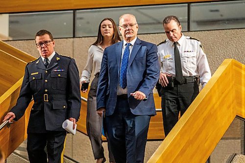 MIKAELA MACKENZIE / WINNIPEG FREE PRESS

RCMP deputy criminal operations officer Scott McMurchy (left), justice minister Kelvin Goertzen, and Winnipeg Police Service chief Danny Smyth walk in to make an announcement about organized crime and illegal guns in Winnipeg on Tuesday, Feb. 21, 2023. For Katie story.

Winnipeg Free Press 2023.