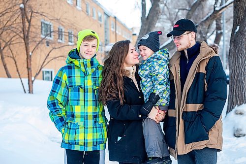 MIKAELA MACKENZIE / WINNIPEG FREE PRESS

Olisya Chychkevych and her sons, Bohdan (15, left), Danylo (four), and Nazariy (22) pose for a photo outside of their apartment building in Winnipeg on Wednesday, Feb. 22, 2023. They came to Winnipeg from Lviv, Ukraine in August. For Brenda story.

Winnipeg Free Press 2023.