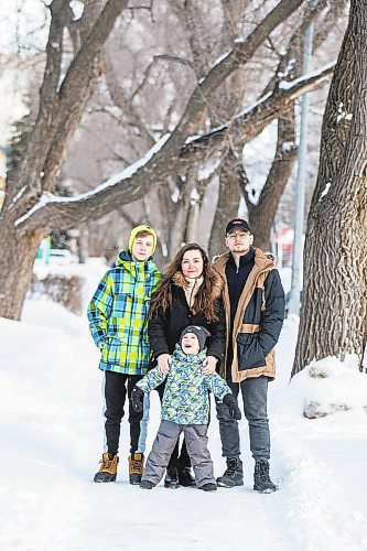 MIKAELA MACKENZIE / WINNIPEG FREE PRESS

Olisya Chychkevych and her sons, Bohdan (15, left), Danylo (four), and Nazariy (22) pose for a photo outside of their apartment building in Winnipeg on Wednesday, Feb. 22, 2023. They came to Winnipeg from Lviv, Ukraine in August. For Brenda story.

Winnipeg Free Press 2023.