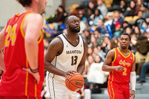 Mike Sudoma/Winnipeg Free Press
Bisons forward Jonam Kazadi goes up for a free throw as they play the Dinos at Investors Group Athletics Centre Saturday evening
February 18, 2023 