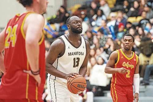 Mike Sudoma/Winnipeg Free Press
Bisons forward Jonam Kazadi goes up for a free throw as they play the Dinos at Investors Group Athletics Centre Saturday evening
February 18, 2023 