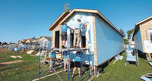WAYNE GLOWACKI / WINNIPEG FREE PRESS

Volunteers were back at it Friday morning finishing up homes  on Lyle St. for  the Habitat for Humanity&#x2019;s 34th Jimmy &amp; Rosalynn Carter Work Project. Melissa Martin story July 14 2017