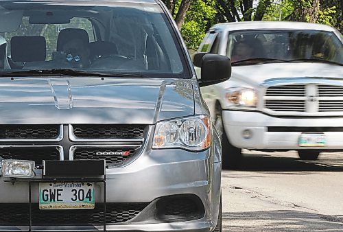 A mobile photo radar unit on Burrows Ave in school zone Tuesday-Operator uses handheld device to capture traffic coming from other direction- His vehicle can capture tickets from both directions- See Aldo Santin story- June 03, 2014   (JOE BRYKSA / WINNIPEG FREE PRESS)