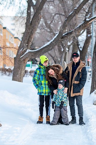 MIKAELA MACKENZIE / WINNIPEG FREE PRESS

Olisya Chychkevych and her sons, Bohdan (15, left), Danylo (four), and Nazariy (22) pose for a photo outside of their apartment building in Winnipeg on Wednesday, Feb. 22, 2023. They came to Winnipeg from Lviv, Ukraine in August. For Brenda story.

Winnipeg Free Press 2023.