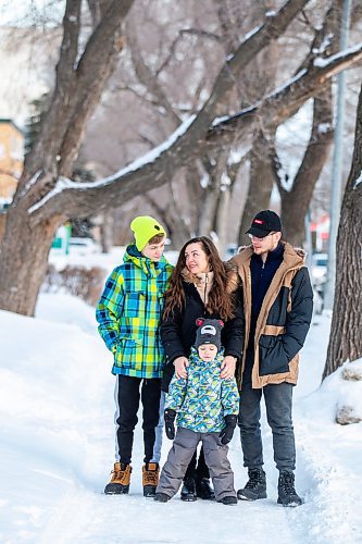 MIKAELA MACKENZIE / WINNIPEG FREE PRESS

Olisya Chychkevych and her sons, Bohdan (15, left), Danylo (four), and Nazariy (22) pose for a photo outside of their apartment building in Winnipeg on Wednesday, Feb. 22, 2023. They came to Winnipeg from Lviv, Ukraine in August. For Brenda story.

Winnipeg Free Press 2023.