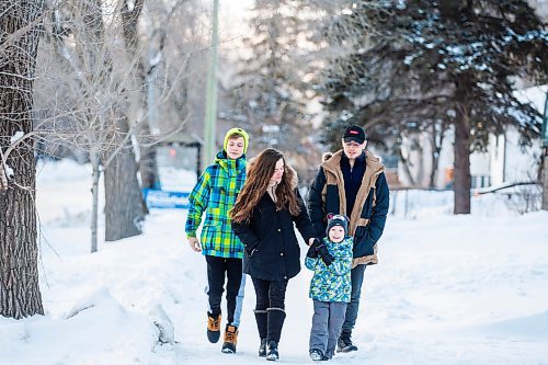 MIKAELA MACKENZIE / WINNIPEG FREE PRESS

Olisya Chychkevych and her sons, Bohdan (15, left), Danylo (four), and Nazariy (22) pose for a photo outside of their apartment building in Winnipeg on Wednesday, Feb. 22, 2023. They came to Winnipeg from Lviv, Ukraine in August. For Brenda story.

Winnipeg Free Press 2023.