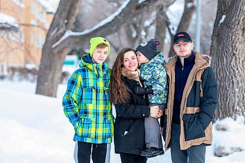 MIKAELA MACKENZIE / WINNIPEG FREE PRESS

Olisya Chychkevych and her sons, Bohdan (15, left), Danylo (four), and Nazariy (22) pose for a photo outside of their apartment building in Winnipeg on Wednesday, Feb. 22, 2023. They came to Winnipeg from Lviv, Ukraine in August. For Brenda story.

Winnipeg Free Press 2023.