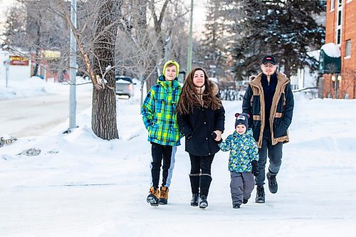 MIKAELA MACKENZIE / WINNIPEG FREE PRESS

Olisya Chychkevych and her sons, Bohdan (15, left), Danylo (four), and Nazariy (22) pose for a photo outside of their apartment building in Winnipeg on Wednesday, Feb. 22, 2023. They came to Winnipeg from Lviv, Ukraine in August. For Brenda story.

Winnipeg Free Press 2023.