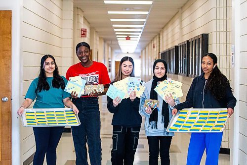 MIKAELA MACKENZIE / WINNIPEG FREE PRESS

Youth Community students Harleen Brar (left), Elizabeth Oguntola, Nancy Pham, Nigha Haq, and Rose Woldemariam pose for a photo with items that will go into the packages they are making for Ukrainian newcomers at Kildonan-East Collegiate in Winnipeg on Wednesday, Feb. 22, 2023. For &#x460;story.

Winnipeg Free Press 2023.