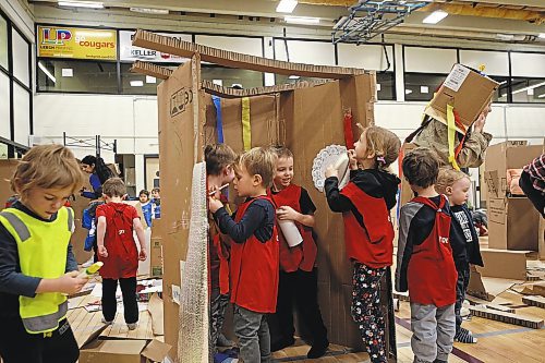 Kids worked together to design and create with cardboard and other simple materials on Friday. (Geena Mortfield/The Brandon Sun)