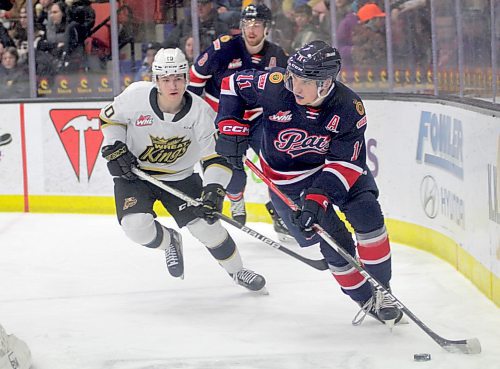 Regina Pats blue-liner Stanislav Svosil carries the puck around his net against while Brandon Wheat Kings forward Caleb Hadland gives chase in Western Hockey League action at Westoba Place on Friday. (Thomas Friesen/The Brandon Sun)