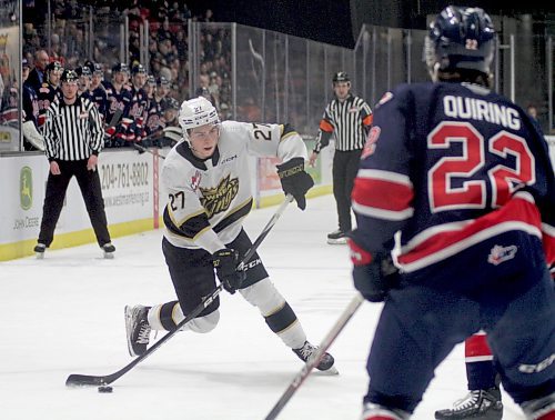 Brandon Wheat Kings defenceman Luke Shipley fires a shot past Regina Pats forward Steel Quiring in Western Hockey League action at Westoba Place on Friday. (Thomas Friesen/The Brandon Sun)