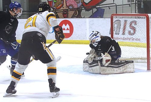 Interlake Lightning goalie Braedan Cormack makes a blocker save as Brandon under-17 AAA Wheat Kings forward Loughlan McMullan (21) charges to the net during Brandon's 6-3 win over the Interlake Lightning at J&amp;G Homes Arena on Saturday afternoon. (Perry Bergson/The Brandon Sun)