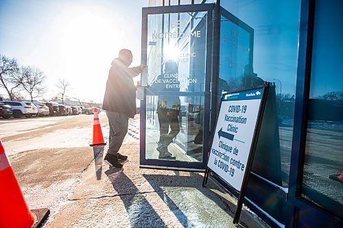 MIKAELA MACKENZIE / WINNIPEG FREE PRESS

Jaimie Orford and his daughter, Amy Orford (11), walk into the Notre Dame vaccine clinic (the final provincial vaccination site) on its last day open in Winnipeg on Saturday, Feb. 25, 2023. For Malak Abas story.

Winnipeg Free Press 2023.