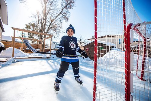 MIKAELA MACKENZIE / WINNIPEG FREE PRESS

Finn Batoon poses for a photo on his backyard rink in Winnipeg on Saturday, Feb. 25, 2023. When Finn moved to Canada from The Philippines in 2019, he was an avid basketball player, but Winnipeg&#x573; cold winters stopped him from shooting hoops year round and he took up hockey instead. He&#x573; now part of the U13 Raiders team. For &#x460;story.

Winnipeg Free Press 2023.