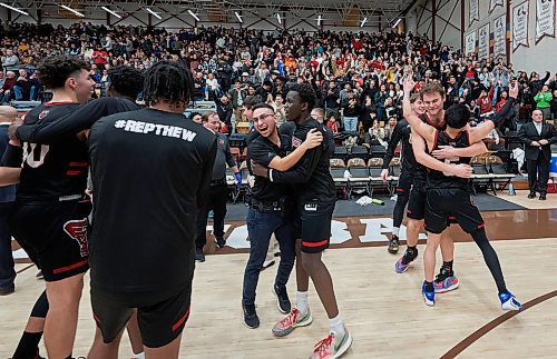 DAVID LIPNOWSKI / WINNIPEG FREE PRESS

The Winnipeg Wesmen celebrate beating the Manitoba Bisons 73-70 during the Canada West Final Four Semi Finals Saturday February 25, 2023 at Investors Group Athletic Centre.
