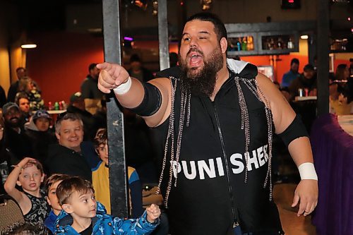 “Canadian Crusher” AJ Sanchez insults members of the audience at The Great Western Roadhouse on his way to the ring, where he faced off against fellow Cloud 9 Wrestling competitor “Sugar” Bob Brennan in a losing effort. (Kyle Darbyson/The Brandon Sun)   