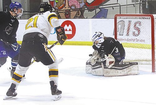 Interlake Lightning goalie Braedan Cormack makes a blocker save as Brandon under-17 AAA Wheat Kings forward Loughlan McMullan (21) charges to the net during Brandon's 6-3 win over the Interlake Lightning at J&amp;G Homes Arena on Saturday afternoon. (Perry Bergson/The Brandon Sun)