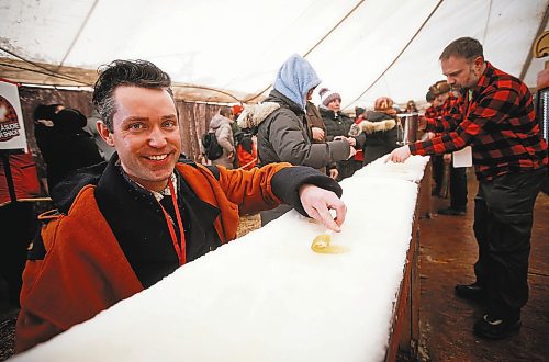 JOHN WOODS / WINNIPEG FREE PRESS
Darrel Nadeau, executive director of Festival du Voyageur, rolls his maple taffy on the last day of the festival Sunday, February 26, 2023. 

Re: macintosh