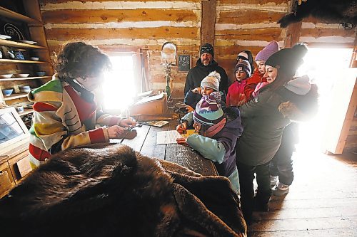 JOHN WOODS / WINNIPEG FREE PRESS
The Kachurowski family visited a historical display where they signed contracts for the Northwest Company on the last day of the Festival du Voyageur Sunday, February 26, 2023. 

Re: macintosh