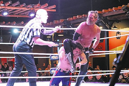 "Toxic” Tyler James throttles “Ice King” Jack Ledger against the ropes during Cloud 9 Wrestling's Saturday evening show at The Great Western Roadhouse in Brandon. Ledger managed to recover from this beating and went on to win the match via pinfall. (Kyle Darbyson/The Brandon Sun)