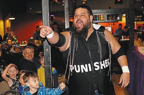 “Canadian Crusher” AJ Sanchez insults members of the audience at The Great Western Roadhouse on his way to the ring, where he faced off against fellow Cloud 9 Wrestling competitor “Sugar” Bob Brennan in a losing effort. (Kyle Darbyson/The Brandon Sun)   