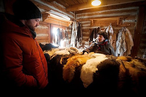 JOHN WOODS / WINNIPEG FREE PRESS
Alex Klippenstein and Zara Ramlal, historical interpreter representing the Northwest Company of 1815, chat about the fur trade on the last day of the Festival du Voyageur Sunday, February 26, 2023. 

Re: macintosh