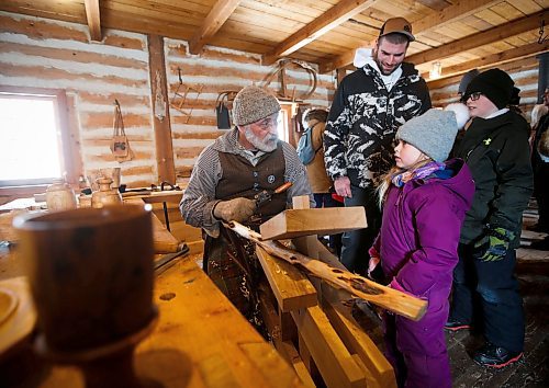 JOHN WOODS / WINNIPEG FREE PRESS
Miah and brother Dominic Guerreiro, with their dad Bryan, talk to wood turner Pedro Bedard on the last day of the Festival du Voyageur Sunday, February 26, 2023. 

Re: macintosh