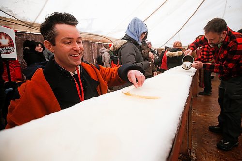 JOHN WOODS / WINNIPEG FREE PRESS
Darrel Nadeau, executive director of Festival du Voyageur, rolls his maple taffy on the last day of the festival Sunday, February 26, 2023.
Re: macintosh