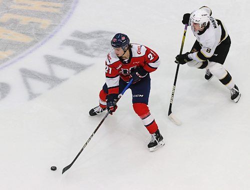 Lethbridge Hurricanes forward Tyson Zimmer carries the puck through the neutral zone as his former Brandon Wheat Kings teammate Quinn Mantei chases him during a game at Westoba Place in November. Mantei will be profiled in Thursday’s edition of The Brandon Sun. (Perry Bergson/The Brandon Sun)