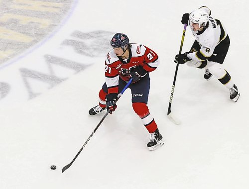 Lethbridge Hurricanes forward Tyson Zimmer carries the puck through the neutral zone as his former Brandon Wheat Kings teammate Quinn Mantei chases him during a game at Westoba Place in November. Mantei will be profiled in Thursday&#x2019;s edition of The Brandon Sun. (Perry Bergson/The Brandon Sun)