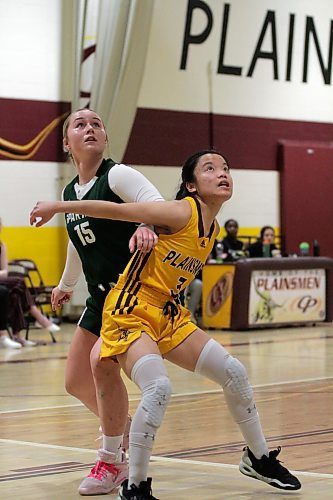 Neelin's Madison Kwiatkowski, left, and Crocus's Alyanna Gungon battle for a rebound during the first half. (Thomas Friesen/The Brandon Sun)