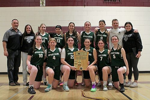 The Neelin Spartans hold the Brandon High School Basketball League varsity girls plaque after beating the host Crocus Plainsmen 56-49 in Game 3 of the final on Tuesday. (Thomas Friesen/The Brandon Sun)